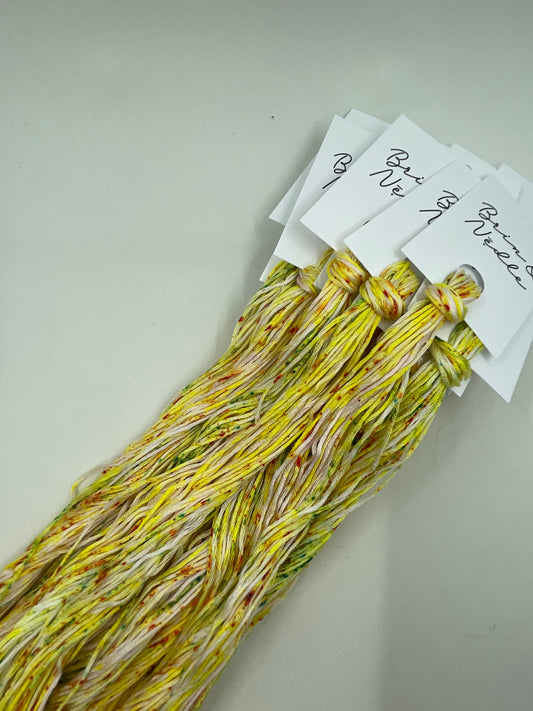 Six strand cotton floss variegated with lemon lime and orange speckles