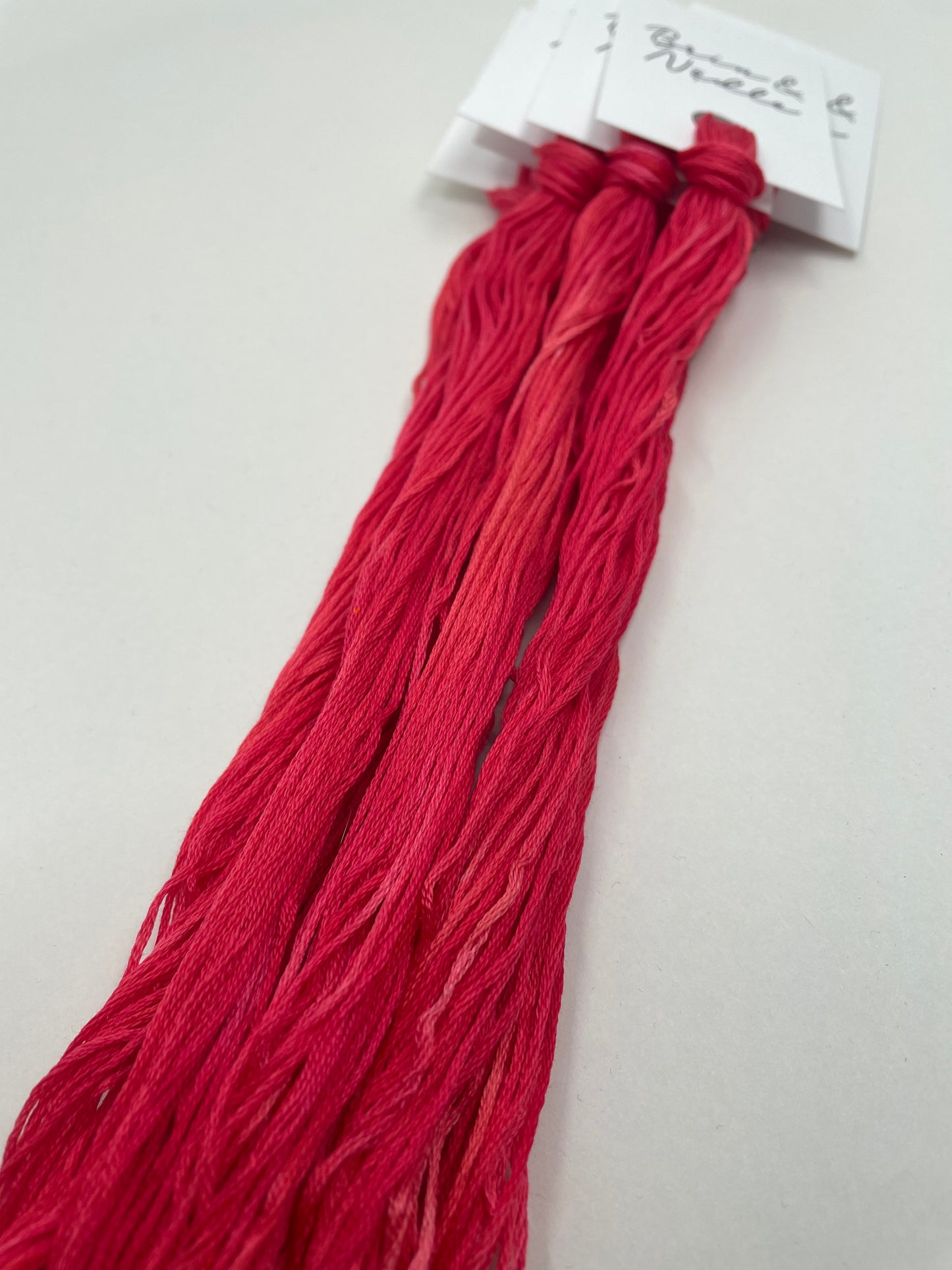 Six strand cotton floss in a delicious pink red