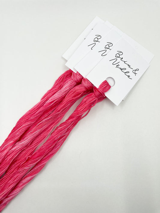 Six strand cotton floss in a rich variegated hot pink