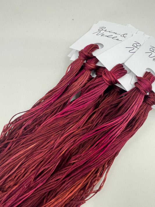 Six strand cotton floss in tonal reds