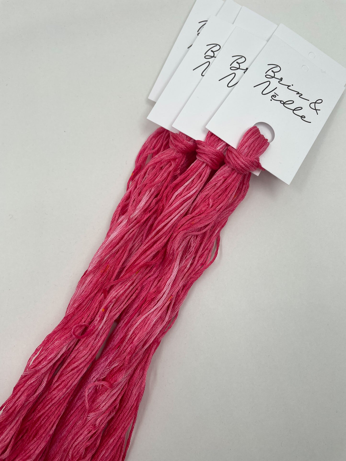 Six strand cotton floss in variegated rosy pink with bubble gum