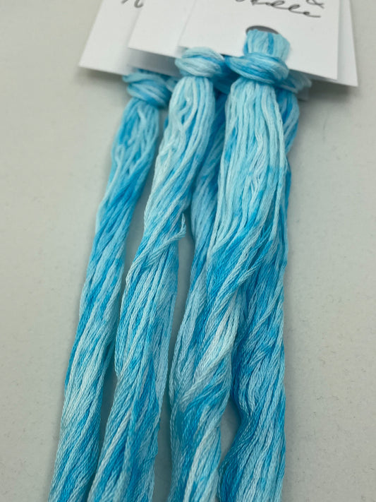 Six strand cotton floss that is a beautiful variegation of icy blues.